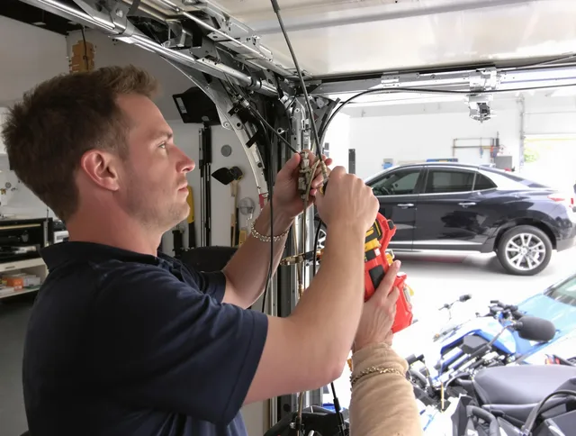 Alafaya Garage Door Repair safety certified technician performing cable replacement in Alafaya