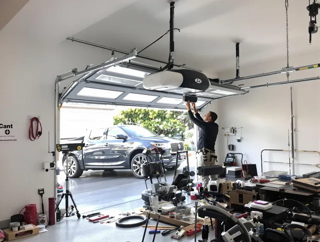 Alafaya Garage Door Repair specialist installing smart garage door opener system in Alafaya home